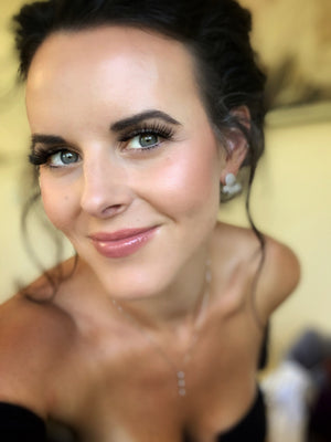 Woman with an updo and red lipstick wearing Glam magnetic lashes